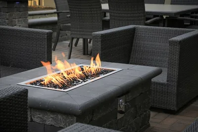 Outdoor fire table with wicker seating